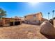 Large gravel backyard featuring a pergola, grill area, and outdoor seating space at 8626 W Las Palmaritas Dr, Peoria, AZ 85345