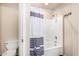 A full bath includes a shower and tub with a modern shower curtain and a standard toilet at 8626 W Las Palmaritas Dr, Peoria, AZ 85345