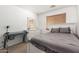 A secondary bedroom features a window for natural light and space for a desk and dresser at 8626 W Las Palmaritas Dr, Peoria, AZ 85345