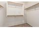 Walk-in closet with white walls, carpeted floor and wooden clothing racks at 8626 W Las Palmaritas Dr, Peoria, AZ 85345