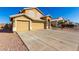 Charming two-story home featuring a three car garage and appealing desert landscaping at 8626 W Las Palmaritas Dr, Peoria, AZ 85345