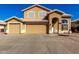 Charming two-story home featuring a three car garage and appealing desert landscaping at 8626 W Las Palmaritas Dr, Peoria, AZ 85345