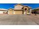 Charming two-story home featuring a three car garage and appealing desert landscaping at 8626 W Las Palmaritas Dr, Peoria, AZ 85345