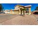 Charming two-story home featuring a three car garage and appealing desert landscaping at 8626 W Las Palmaritas Dr, Peoria, AZ 85345