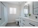 Bright bathroom featuring a double vanity with sleek black fixtures and ample counter space at 8637 E Mulberry St, Scottsdale, AZ 85251