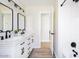 Modern bathroom showcasing a double sink vanity, sleek black fixtures, and a bright, clean aesthetic at 8637 E Mulberry St, Scottsdale, AZ 85251