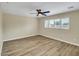 Spacious bedroom with a ceiling fan, large window, and hardwood floors, providing a bright and airy atmosphere at 8637 E Mulberry St, Scottsdale, AZ 85251