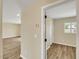 Hallway view highlights the easy access to other rooms and showcases the continuous hardwood floors at 8637 E Mulberry St, Scottsdale, AZ 85251