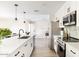 Bright kitchen with a quartz countertop island and stainless steel appliances at 8637 E Mulberry St, Scottsdale, AZ 85251