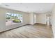 Inviting living room with new flooring, a large window, and plenty of natural light at 8637 E Mulberry St, Scottsdale, AZ 85251