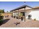 Cozy covered patio with seating, plants, and a grill, perfect for outdoor entertaining at 8637 E Mulberry St, Scottsdale, AZ 85251