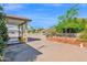 Large backyard featuring a covered patio, mature trees, and ample space for outdoor activities at 901 E Hearn Rd, Phoenix, AZ 85022