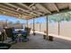 Covered patio with a ceiling fan and outdoor furniture, perfect for entertaining or relaxing in the backyard at 901 E Hearn Rd, Phoenix, AZ 85022