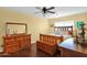 Bedroom featuring a wood dresser, a bed with nightstands, and wood floors at 901 E Hearn Rd, Phoenix, AZ 85022