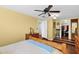 Bedroom featuring a comfortable bed, a ceiling fan, and hardwood floors at 901 E Hearn Rd, Phoenix, AZ 85022