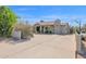 Charming home featuring a well-maintained yard, mature landscaping, and a long driveway with basketball hoop at 901 E Hearn Rd, Phoenix, AZ 85022