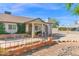 Charming single-story home with lush greenery, a decorative front fence, and a welcoming entrance at 901 E Hearn Rd, Phoenix, AZ 85022