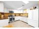 Bright kitchen featuring stainless steel appliances, tile floors, and white cabinetry at 901 E Hearn Rd, Phoenix, AZ 85022