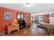 Bright and stylish living room with hardwood floors, an eclectic design, and connecting to the dining area at 901 E Hearn Rd, Phoenix, AZ 85022