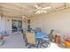 Back patio featuring ceiling fans, a table and chairs perfect for outdoor seating and dining at 901 E Hearn Rd, Phoenix, AZ 85022