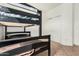 Bedroom featuring bunk bed, tile flooring, and closet at 9325 W Elwood St, Tolleson, AZ 85353