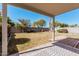 Backyard with grass, trees, foliage, and a covered patio at 977 E Saratoga St, Gilbert, AZ 85296