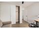 Bedroom featuring a fan, closet, desk, and laminate floors at 977 E Saratoga St, Gilbert, AZ 85296