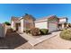 Inviting home exterior with well-manicured landscaping, a tiled roof, and a welcoming front entrance at 977 E Saratoga St, Gilbert, AZ 85296