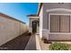 View of a home's front entrance featuring a red tiled roof, walkway, and drought-tolerant landscaping at 977 E Saratoga St, Gilbert, AZ 85296