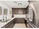 Well-lit kitchen featuring shaker cabinets, quartz countertops, stainless steel appliances, and a modern faucet at 977 E Saratoga St, Gilbert, AZ 85296