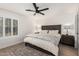 Serene bedroom featuring a comfortable bed, ceiling fan, and a cozy rug at 977 E Saratoga St, Gilbert, AZ 85296