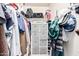 Organized walk-in closet featuring shelving, hanging racks, and gray storage cubes at 977 E Saratoga St, Gilbert, AZ 85296