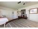 Bedroom showing neutral carpet, dark wood accents, and natural lighting for a warm and inviting atmosphere at 10106 W Highwood Ln, Sun City, AZ 85373