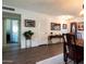 Hallway view with wood flooring and decorative console table at 10106 W Highwood Ln, Sun City, AZ 85373