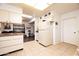 Well-lit kitchen featuring classic cabinets, tile floors, and lots of storage at 10106 W Highwood Ln, Sun City, AZ 85373