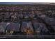 Expansive aerial view of a residential neighborhood showcasing neat homes and sparkling community pools at 10547 E Relativity Ave, Mesa, AZ 85212