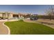 Expansive backyard featuring a pool, spa, seating areas, and an outdoor space perfect for relaxation and entertaining at 10547 E Relativity Ave, Mesa, AZ 85212