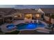 Private backyard featuring a pristine pool and hot tub, perfect for outdoor entertainment and relaxation at 10547 E Relativity Ave, Mesa, AZ 85212