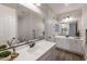 Dual sink bathroom featuring a large mirror and modern fixtures at 10547 E Relativity Ave, Mesa, AZ 85212