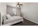 Cozy bedroom with lots of light, a white bed frame, and a ceiling fan at 10547 E Relativity Ave, Mesa, AZ 85212