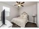 Relaxing bedroom featuring a full size bed, a ceiling fan, and lots of light at 10547 E Relativity Ave, Mesa, AZ 85212