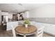 Cozy breakfast nook featuring lots of natural light and seamless flow to the kitchen at 10547 E Relativity Ave, Mesa, AZ 85212