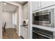 Kitchen detail showcasing stainless steel appliances and granite countertops at 10547 E Relativity Ave, Mesa, AZ 85212