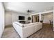 Spacious living room with recessed lighting, ceiling fan, and a large sectional sofa at 10547 E Relativity Ave, Mesa, AZ 85212