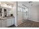 Beautiful main bathroom with a walk-in shower, granite countertop vanity, and tile flooring at 10547 E Relativity Ave, Mesa, AZ 85212