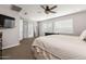 Another view of main bedroom featuring a large bed and door to the bathroom at 10547 E Relativity Ave, Mesa, AZ 85212