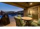 Covered patio with ceiling fan and furniture, providing a comfortable outdoor living space overlooking the pool area at 10547 E Relativity Ave, Mesa, AZ 85212