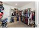 Spacious walk-in closet with custom shelving and hanging rods for optimal organization at 10547 E Relativity Ave, Mesa, AZ 85212