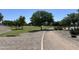 Lush green community park offers walking trail and well-manicured lawns under a bright blue sky at 1077 E Loma Vista St, Gilbert, AZ 85295