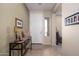 Welcoming entryway featuring tile flooring, neutral paint, and a console table at 10817 W Swayback Pass, Peoria, AZ 85383